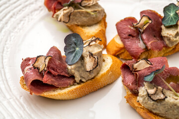 Gourmet appetiser on a white plate