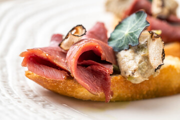 Gourmet appetiser on a white plate