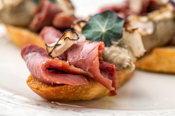 Gourmet appetiser on a white plate