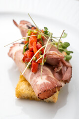 Gourmet appetiser on a white plate