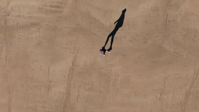 Fit Active Person Running On The Sandy Shoreline