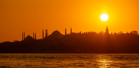 Panoramic sunset of the historical peninsula in Istanbul, silhouettes of sultanahmet mosque, hagia Sophia mosque, topkapi palace in the background,Turkey
