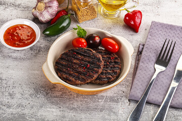 Grilled burger cutlet with sauce