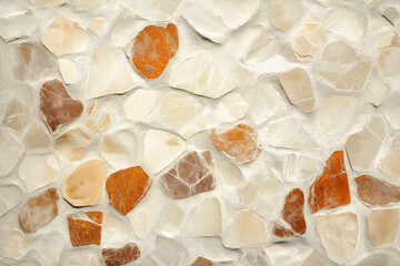 White and brown rough grained stone or concrete stucco wall, texture background