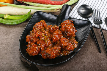 Manchurian chicken with sauce and spices