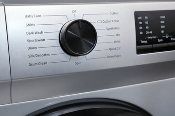Close-up of the control panel of a modern washing machine.