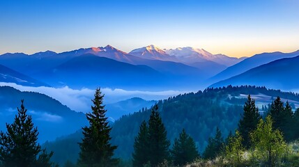 Obraz premium Serene mountain landscape at dawn with mist and vibrant colors.