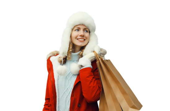 Happy smiling young woman with shopping bag in winter hat, clothes isolated on white background