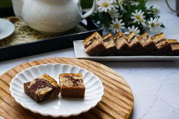 Slices of marble cake on white plates