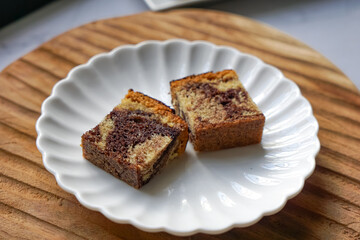 Slices of marble cake on white plates