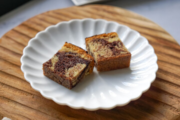 Slices of marble cake on white plates
