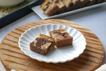 Slices of marble cake on white plates