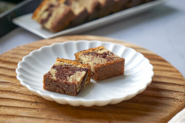 Slices of marble cake on white plates