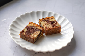 Slices of marble cake on white plates