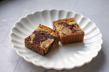 Slices of marble cake on white plates