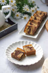 Slices of marble cake on white plates