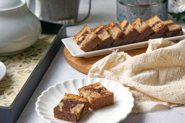 Slices of marble cake on white plates