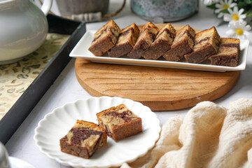 Slices of marble cake on white plates