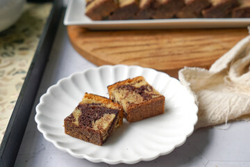 Slices of marble cake on white plates