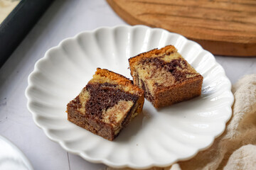 Slices of marble cake on white plates