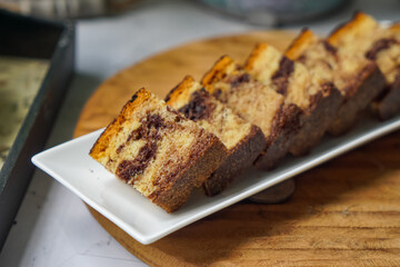 Slices of marble cake on white plates