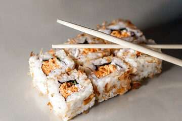 Sushi rolls. Japanese food in restaurant. Sushi roll set with salmon, vegetables and rice. Asian food concept. Japanese cuisine.