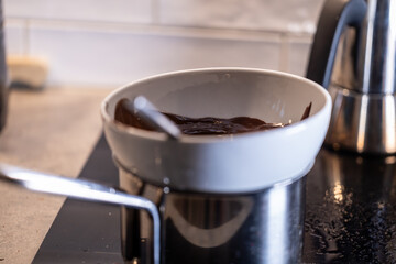 Stockholm, Sweden Chocolate melts over a steam bath on the stove for baking.