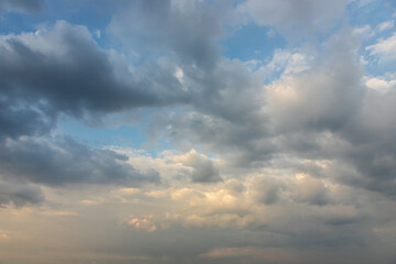 Obraz premium Ornamental clouds. Dramatic sky. Epic storm cloudscape Soft sunlight. Panoramic image texture background graphic resources design Meteorology, heaven hope peace concept