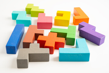 Obraz premium Logical thinking and problem solving creative business solution concept, wooden puzzle geometric shape block shape.