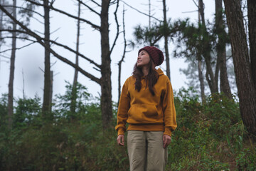 Portrait image of a woman traveling in the forest