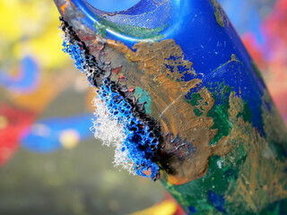Close-up detail of a painter's old used paint brush