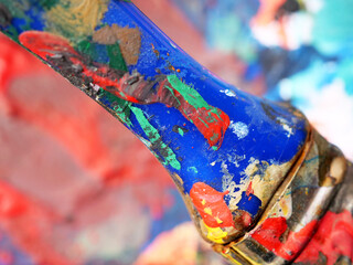 Close-up detail of a painter's old used paint brush