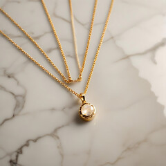 Fototapeta premium A minimalist gold necklace with a small pendant, placed on a marble surface under even lighting.