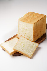 Sliced ​​toast bread on board white background isolated background