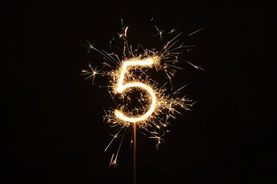 Minimalist Photography: Glowing Sparkler Shaped as Number Five for Festive Celebrations