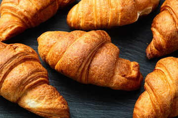 Group of sweet croissant . French morning breakfast . Top view