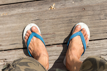 People wear flip flops wooden floor home