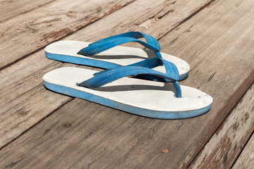 Slippers on the wooden floor outside the house