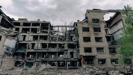 Fototapeta premium destroyed and burned houses in the city in Ukraine