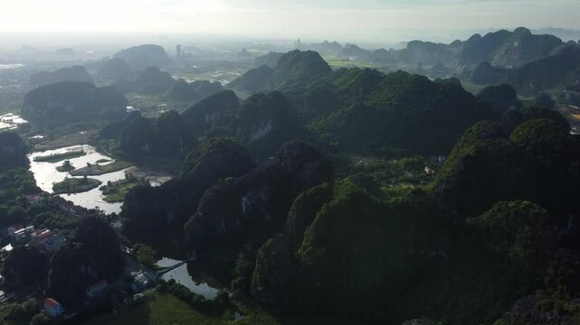Majestic view of contrasty Vietnamese rural scenery, aerial tilt up