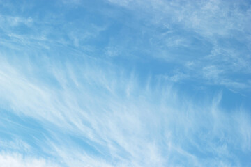 Fototapeta premium Uniform background of blue sky and cirrus cloud patterns.