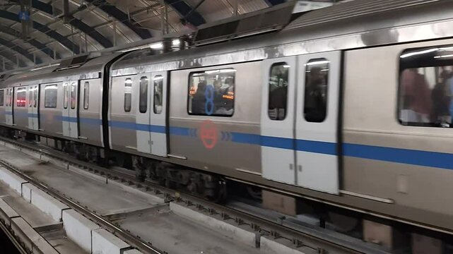 New Delhi, India, August 12 2024 - Delhi Metro train arriving at Jhandewalan metro station in New Delhi, India, Asia, Public Metro departing from Jhandewalan station