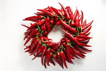 Naklejka premium Photography of Red Hot Chili Peppers Keep Circle Around Center, Vibrant Spice Collection for Food Blogs, Recipes, Spice Packaging, E-commerce, Cookbooks, Ads, Social Media, Branding
