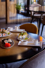 Set Table with Sushi and Cutlery in a Restaurant