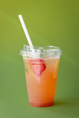 Strawberry Lemonade on a Solid Green Background