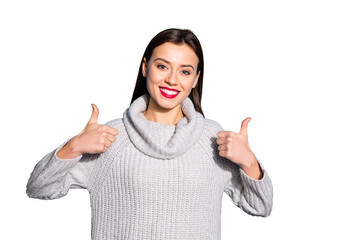 Portrait of charming youth showing thumb up promotion wearing gray pullover isolated over blue...