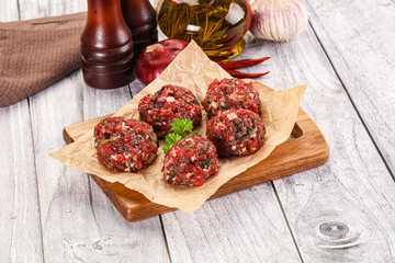 Raw beef meatballs for cooking