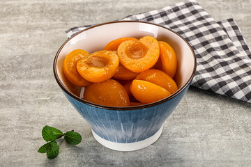 Sweet canned apricots with syrope