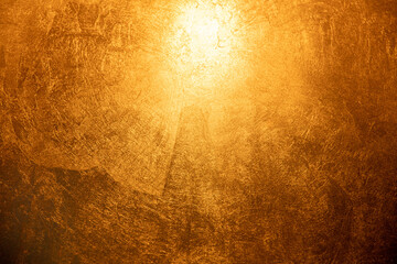 Background with a bronze or golden scratched surface with a highlight at the top center.