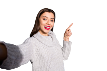 Photo of pretty lady making selfies indicating arm empty space wear warm knitted pullover isolated blue background